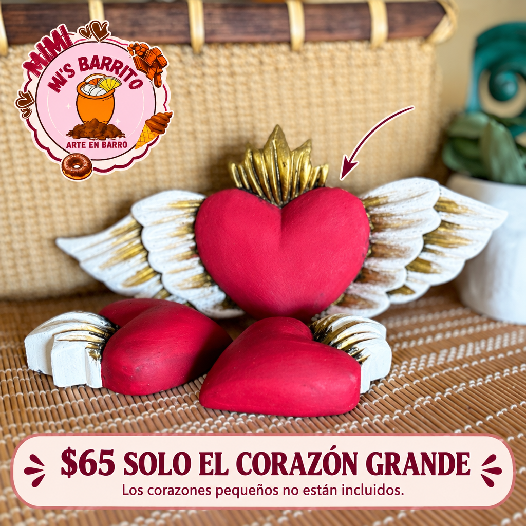 Corazón milagrito grande rojo con alas blancas y detalles dorados, señalado con precio $65; corazones pequeños no incluidos